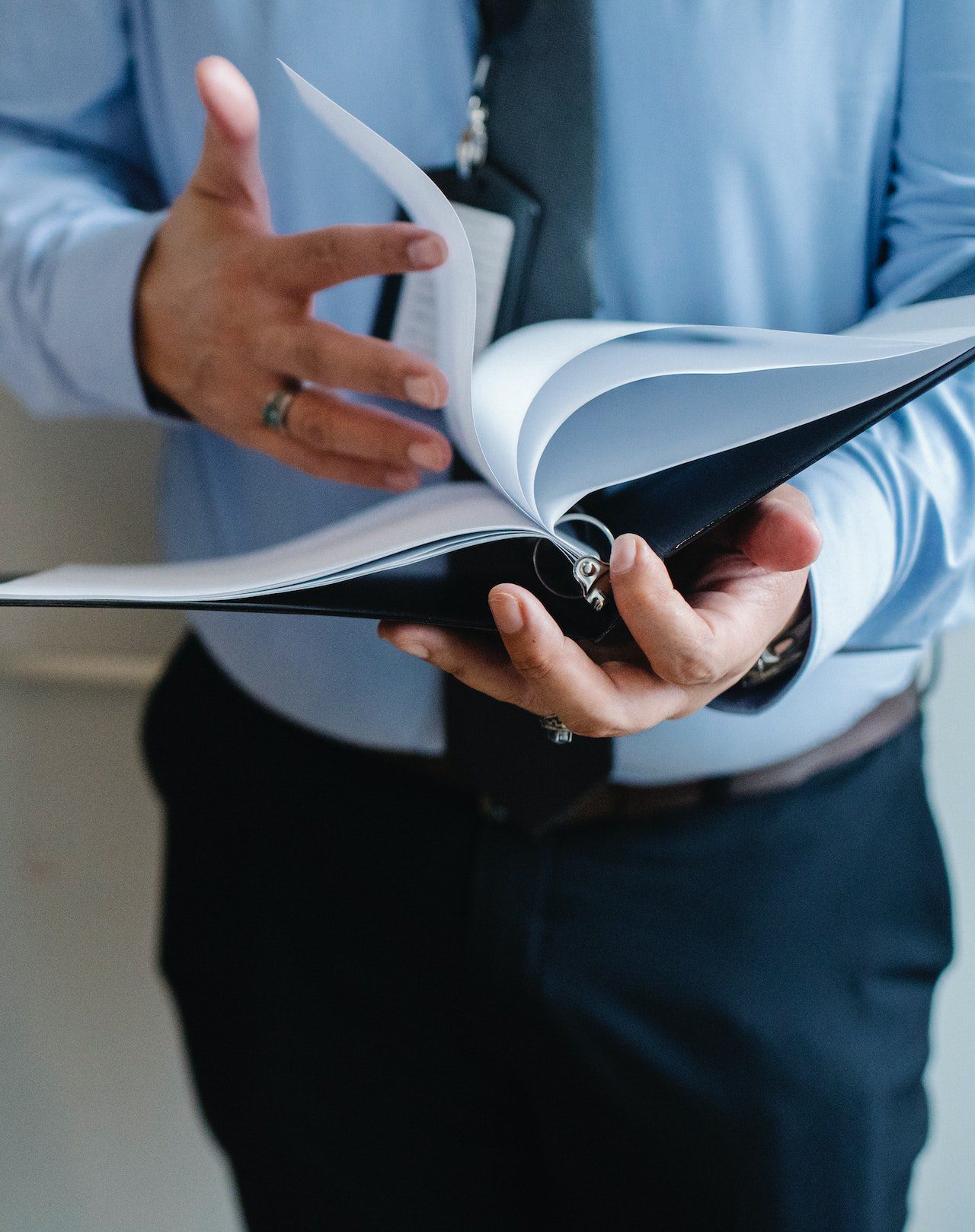 Businessman reading documents in office Businessman reading documents in office<br />